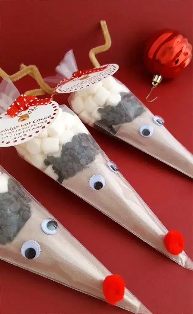 Creative housewarming party favor cones with googly eyes and pom-pom noses. Perfect for celebrating.