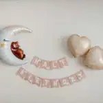 17 Creative Half Birthday Ideas Cute moon and heart-shaped balloons for half birthday celebration.