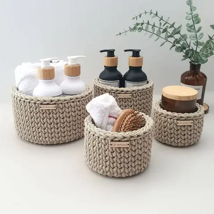 Elegant crochet storage baskets for bathroom organization and gift ideas.