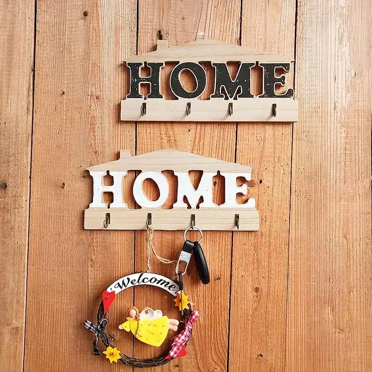 Wooden wall hooks with "HOME" sign, perfect for housewarming gifts for couples.