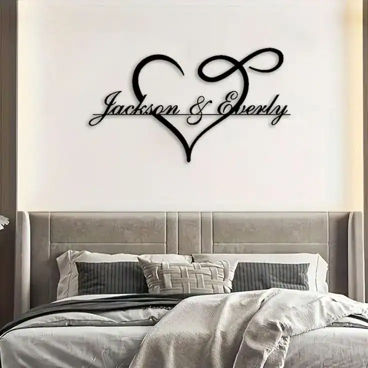 Heart-shaped wall decor with "Jackson & Everly" script for personalized bedroom or living room decor.