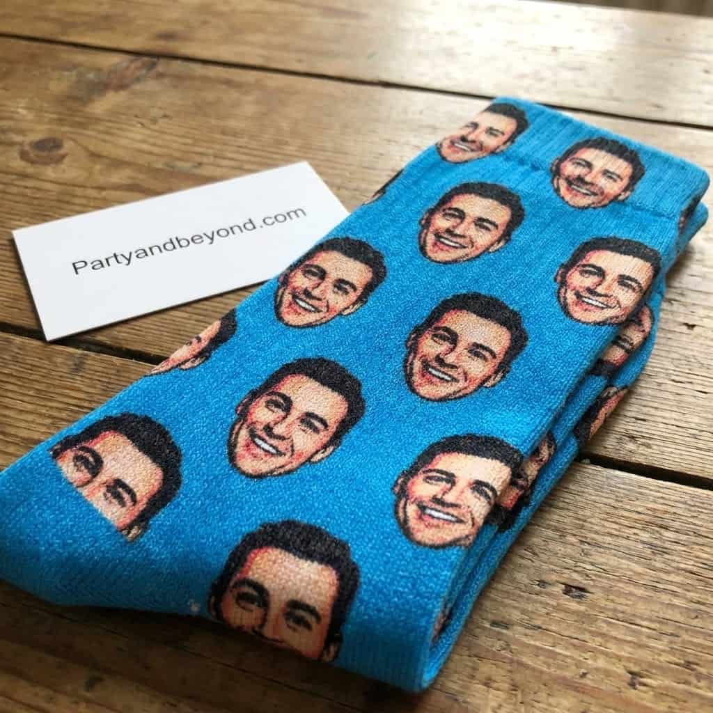 Blue socks with smiling men's faces, fun gift for him.