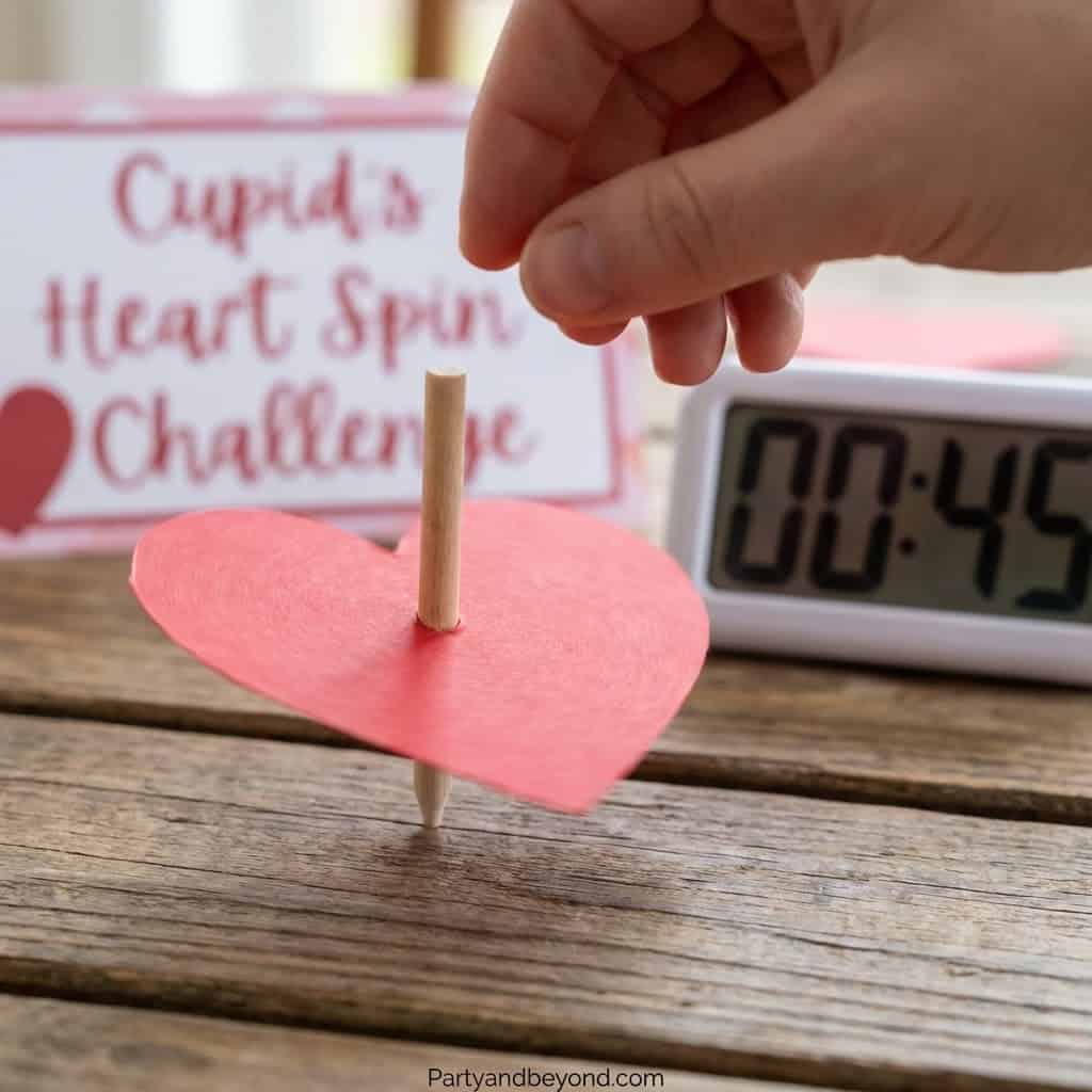 Valentine's Day heart spin game with timer for fun party activities.