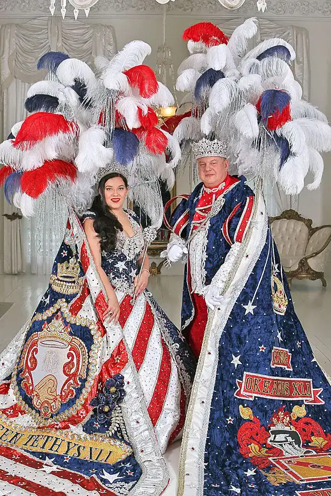 Colorful Mardi Gras costumes with feathers and beads.