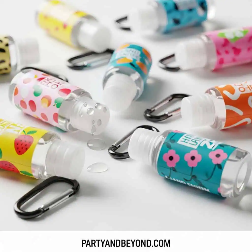 Colorful baby shower favor bottles with clips for guests.