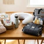 19 Useful Baby Shower Gifts for Mom Baby shower gift set with essentials for new moms, including skincare, cozy blanket, and travel acce.