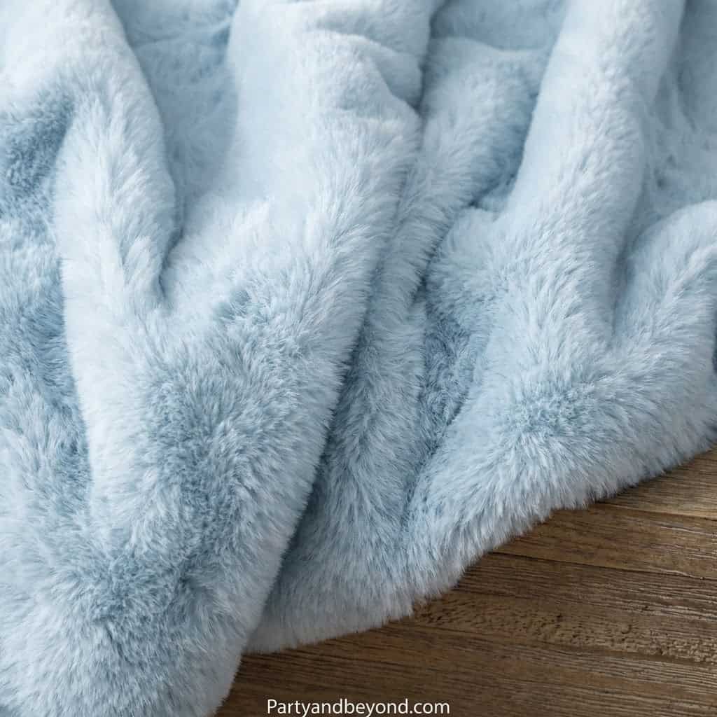 Soft gray faux fur blanket perfect for birthday gifts for mom. Luxurious texture ideal for cozy home.