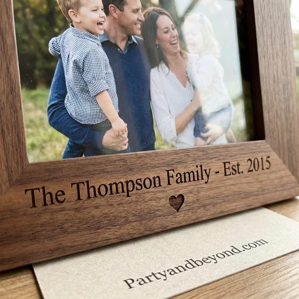 Personalized family photo frame with engraved name and date, perfect for Mother's Day gifts.