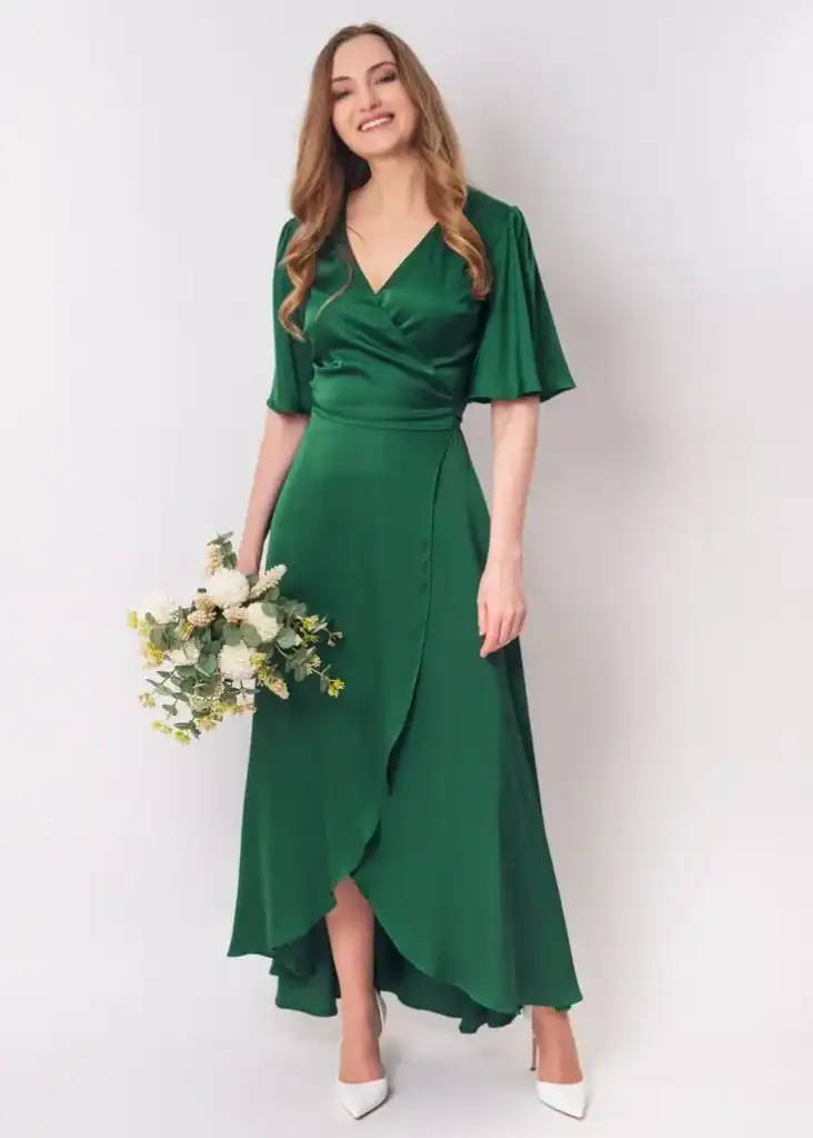 Woman in green St. Patrick's Day dress with wrap style and flowy skirt.