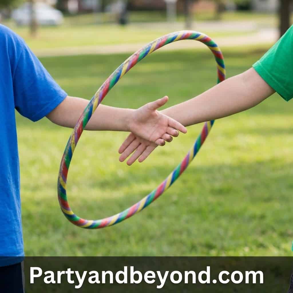 Kids playing with colorful hula hoop during outdoor field day activities.