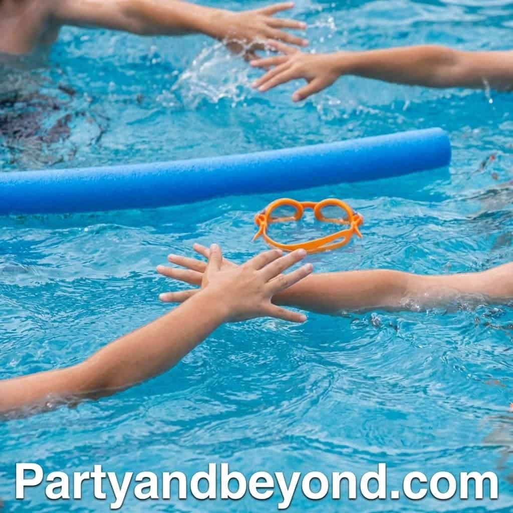 Kids playing with goggles and pool noodles in a swimming pool.