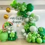 17 St. Patrick’s Day Decor Ideas Colorful St. Patrick’s Day balloon arrangement with green, white, and gold balloons.