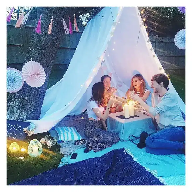Kids celebrating summer birthdays with colorful balloons and fun accessories.