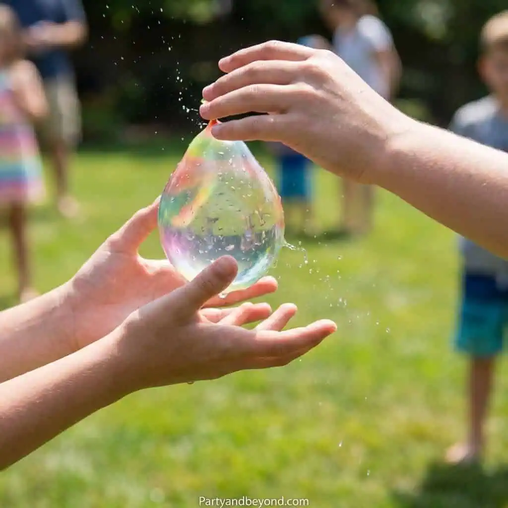 Kids playing with a giant soap bubble at a field day event.