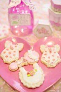 Baby shower favors – decorated cookies with pink designs for guests