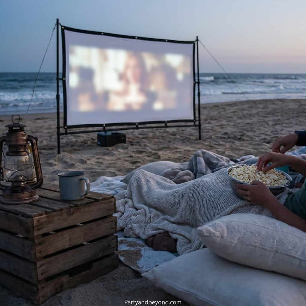 Outdoor beach movie projector for adult birthday parties, ideal for beach celebrations and summer ga.