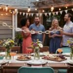 25 Budget Friendly Birthday Party Ideas for Adults That Feel Stylish and Fun Outdoor birthday celebration with friends and decorated table.