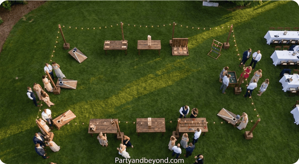 Outdoor carnival wedding games with guests playing and enjoying fun, interactive activities.