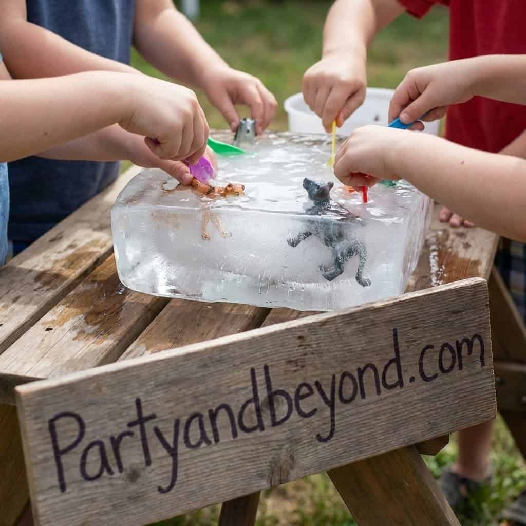 Ice fishing game for kids at birthday parties, featuring kids catching toy fish from a block of ice.