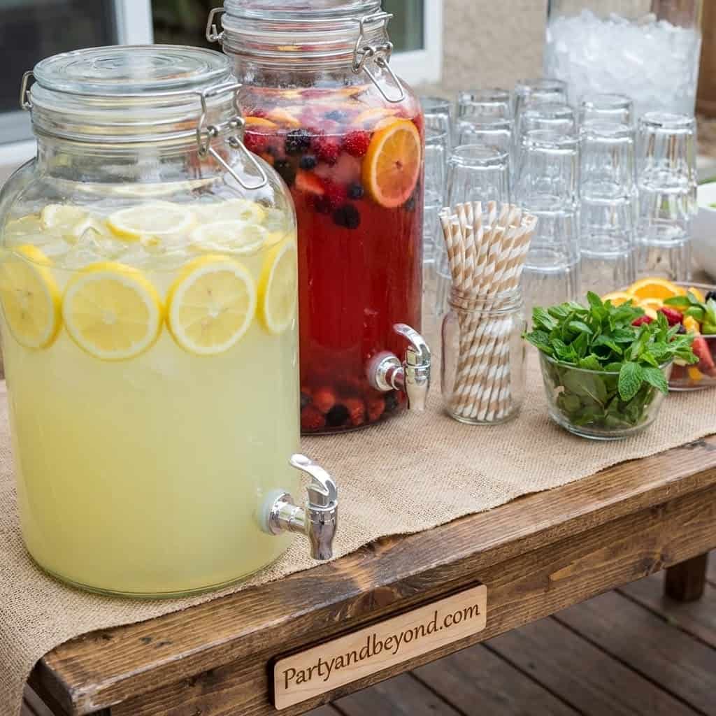 Refreshing lemonade and berry-infused water for party guests.