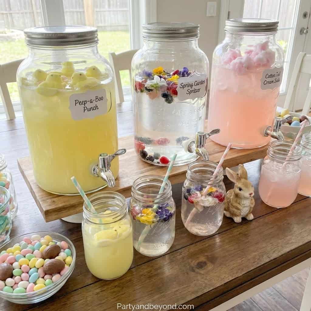 Colorful beverage dispensers with themed drinks for Easter celebration.