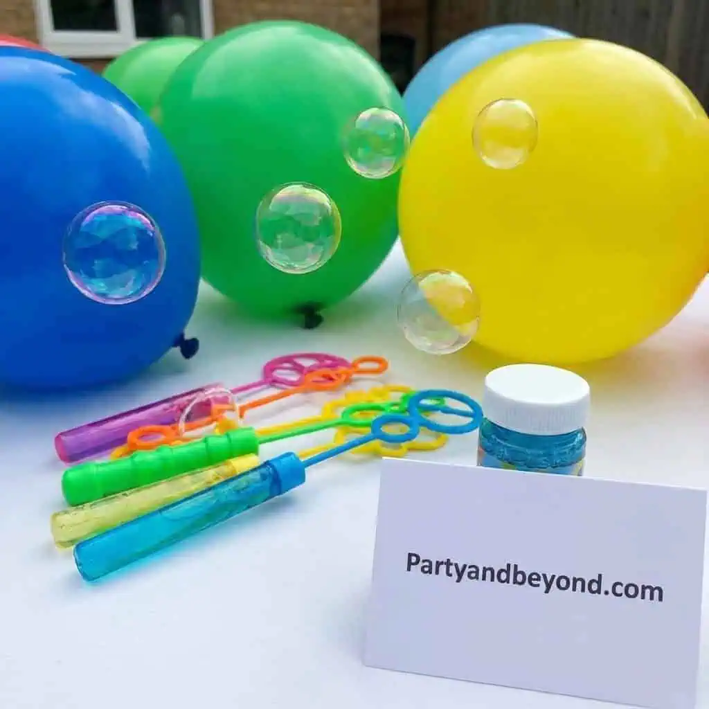 Colorful balloons and bubble wands for a Nemo-themed birthday party.