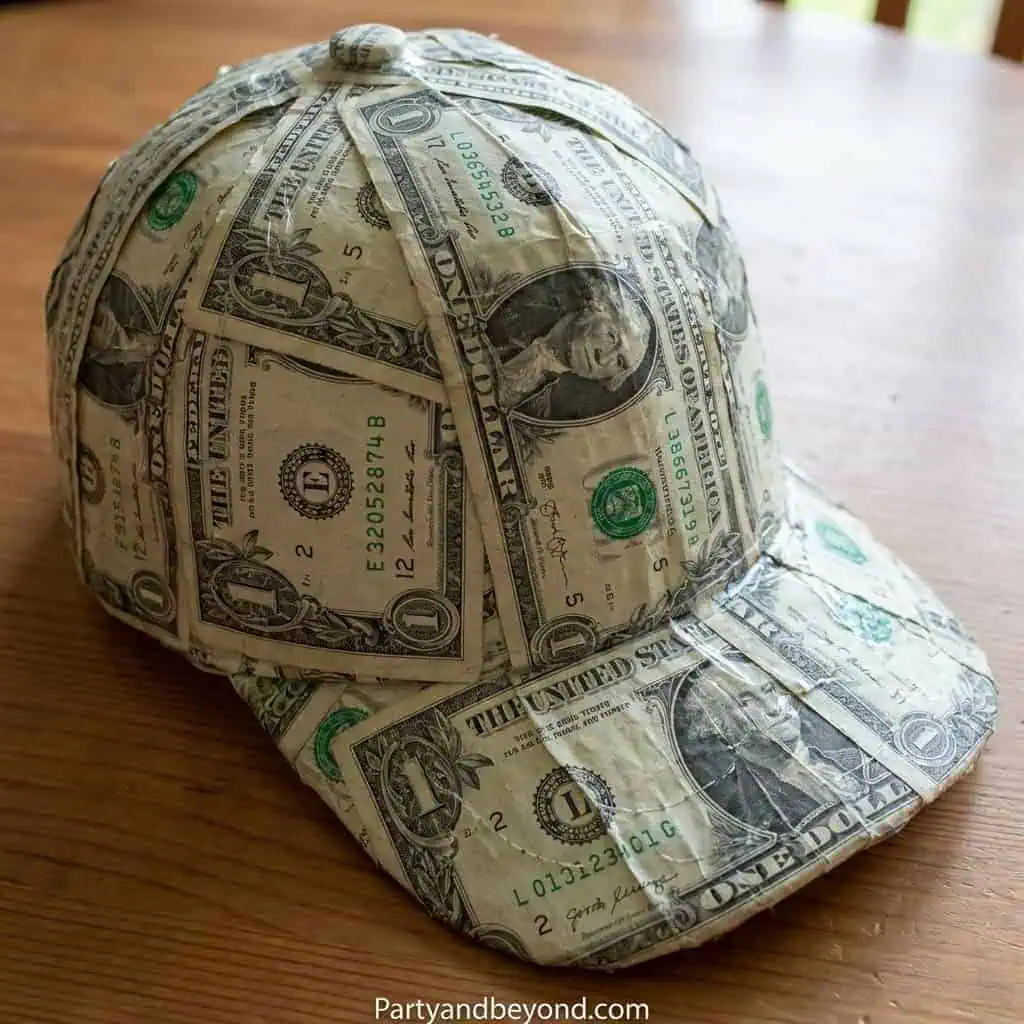 Custom dollar bill baseball cap for graduation celebration.