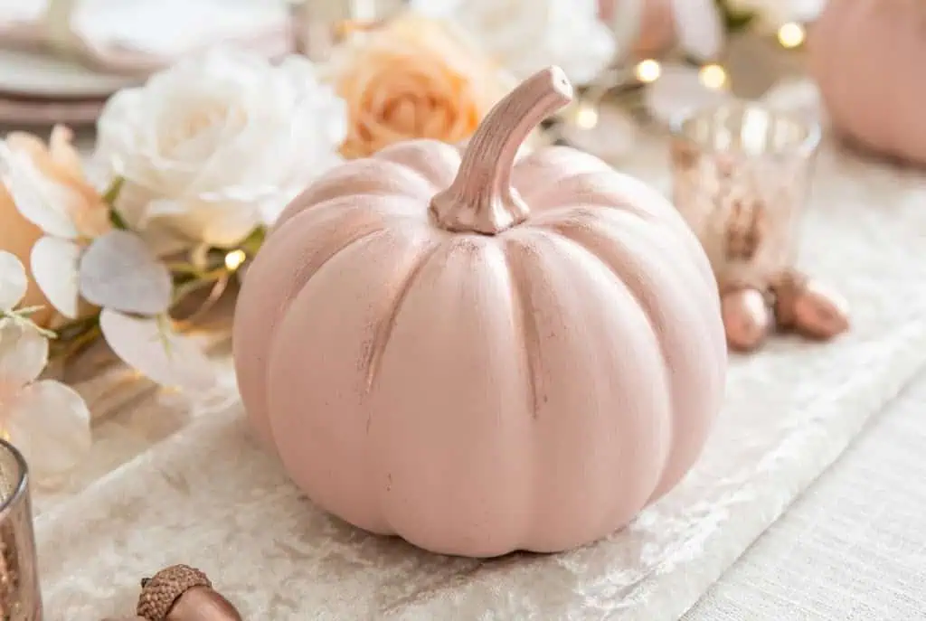 Blush pink pumpkin with rose gold metallic highlights on ridges