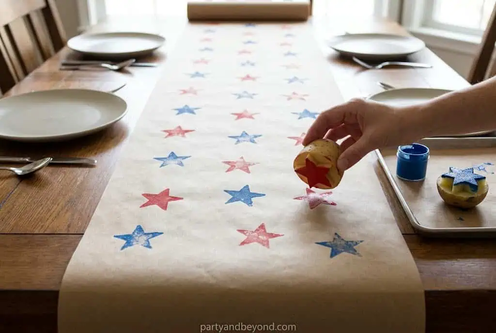 Kraft paper table runner with hand-stamped patriotic stars