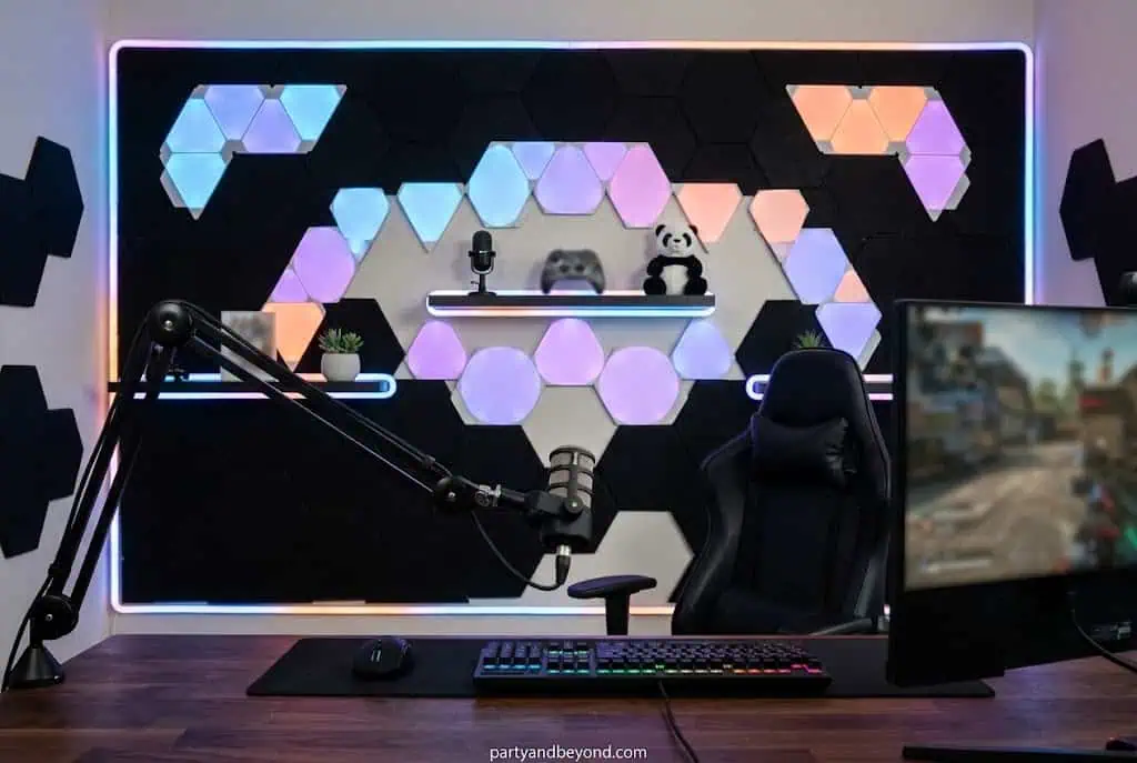 DIY streamer wall backdrop in school colors used as graduation photo booth background