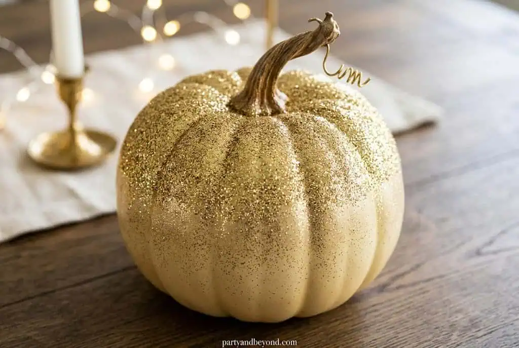Elegant gold glitter pumpkin for festive fall and Halloween celebrations.Elegant Pumpkin Painting Ideas