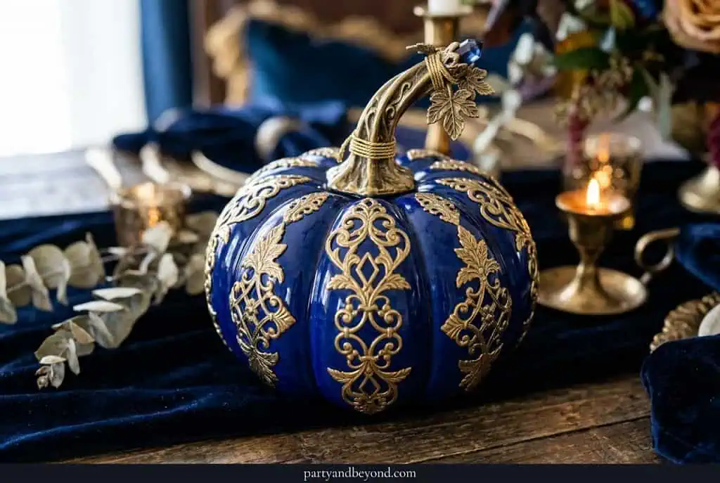 Cobalt blue pumpkin with brass metallic accents on stem