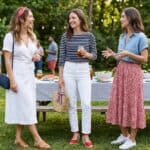 25 Stunning 4th of July Outfit Ideas for Women That Aren't Tacky (2026) Women celebrating 4th of July with stylish outfits in a backyard setting.