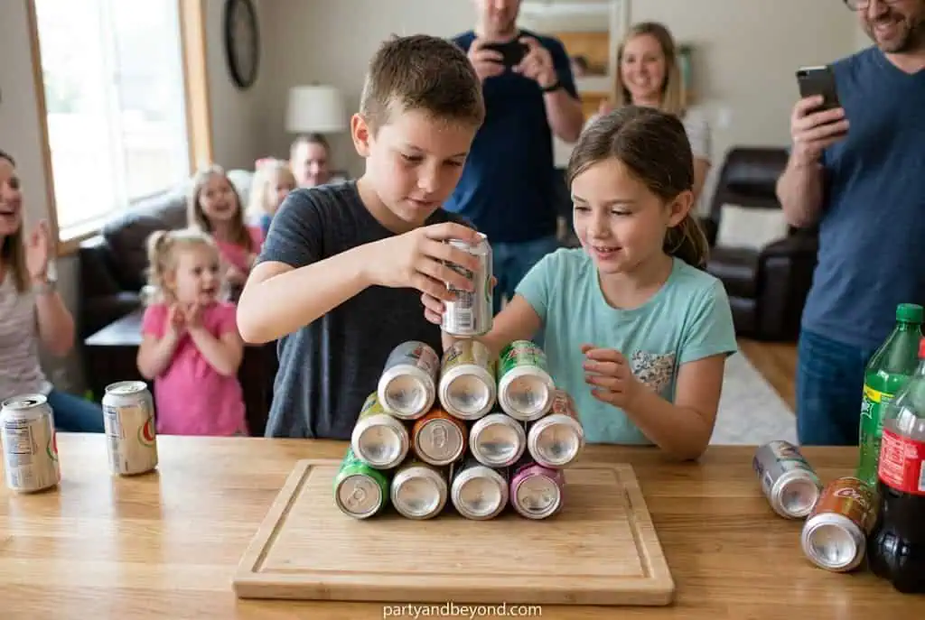 Stack of empty aluminum cans arranged in a pyramid during a minute to win it challenge