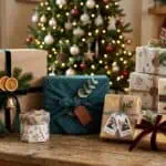 Christmas Gift Wrapping Ideas That Wow: 12 Creative Techniques for 2026 Handmade Christmas wrapping paper with painted gold stripes and star patterns on kraft paper