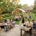 4th of July Backyard Party for 50 Guests: Brilliant Ideas for an Unforgettable Celebration Outdoor garden party with guests, drinks, and string lights at dusk. Perfect for celebrations and so.