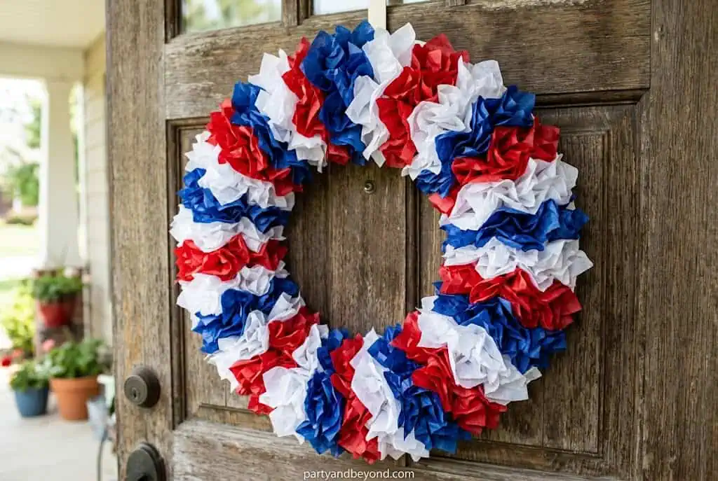 Patriotic paper plate wreath made with red white and blue tissue paper 4th of July Decorations on a Tight Budget