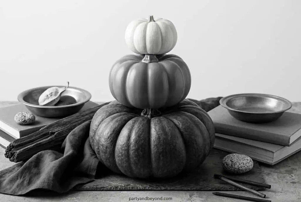 Pumpkin centerpiece with stacked gourds and autumn-themed decor for fall celebrations.Elegant Pumpkin Painting Ideas