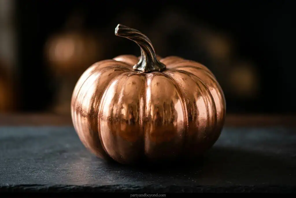 Fully copper-painted metallic pumpkin with shiny reflective surface