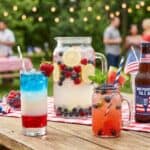 10 Best 4th of July Cocktails and Drinks to Serve at Your Backyard Party Colorful patriotic cocktails and drinks for 4th of July celebrations outdoors.