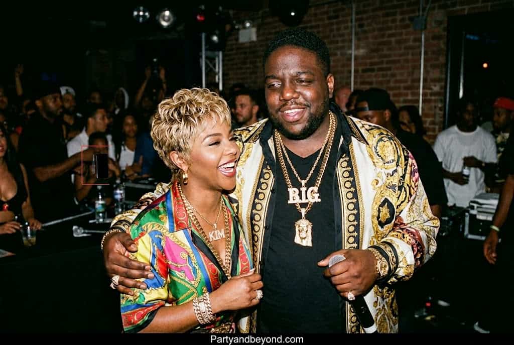 90s hip-hop Halloween costume inspired by Lil' Kim and Biggie Smalls with Coogi sweater.