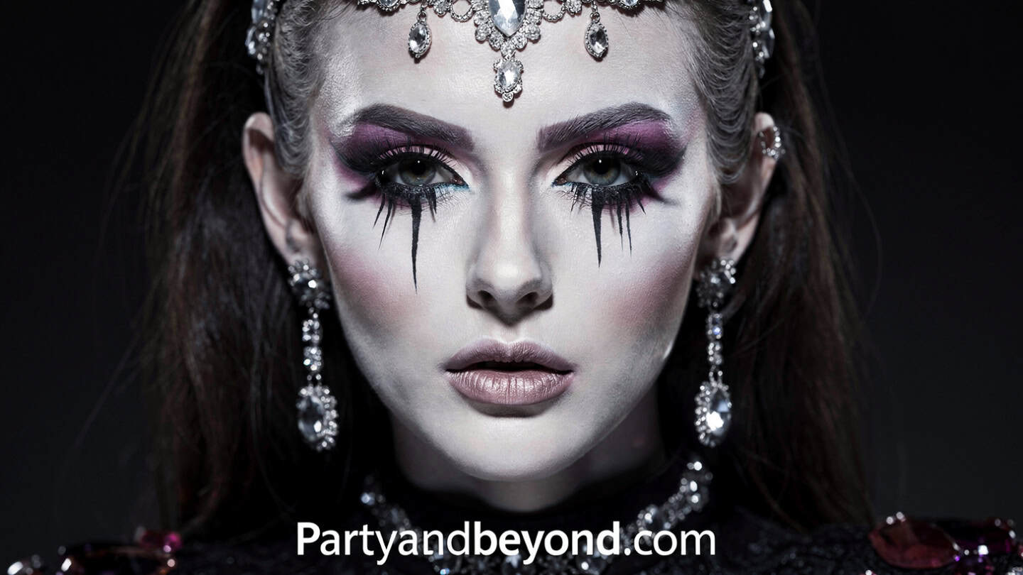 Upside down Halloween makeup illusion with reversed facial features drawn on forehead