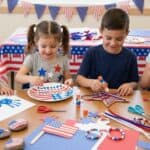 20 Easy 4th of July Crafts for Kids (Toddlers, Preschool, and Elementary Ages) Kids making patriotic 4th of July crafts with flags and decorations.
