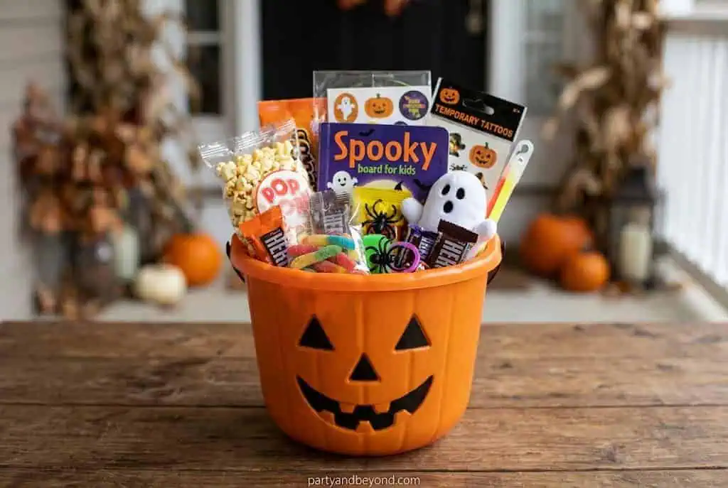 Classic Halloween boo basket with coloring book, glow sticks, candy, stickers, and mini pumpkin