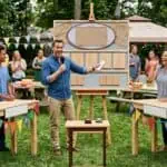 Amazing DIY Family Feud Questions for a Party for Unforgettable Fun Group of friends enjoying an outdoor game night with a host and interactive activities.
