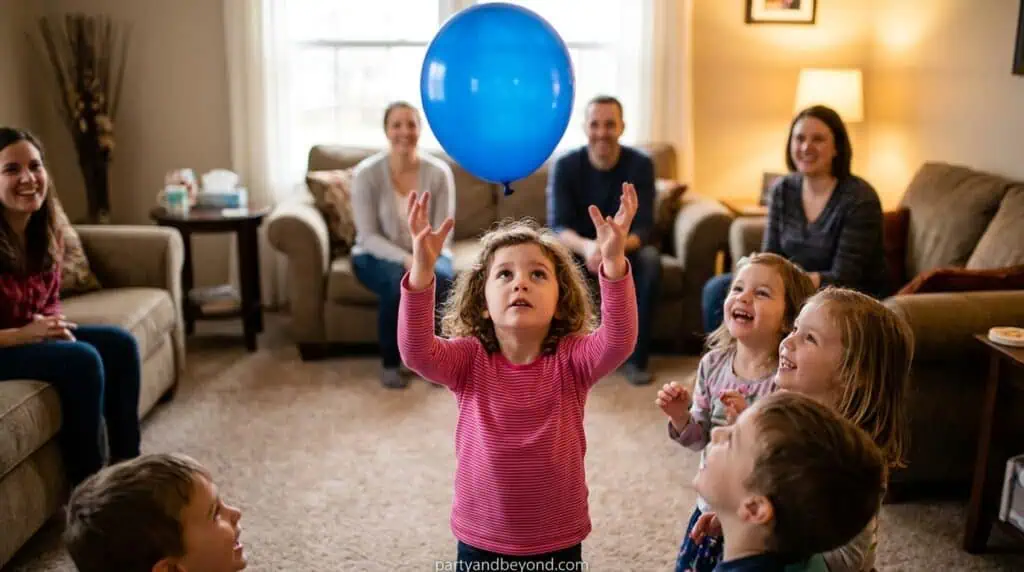 Young child hitting a balloon to keep it from touching the floor