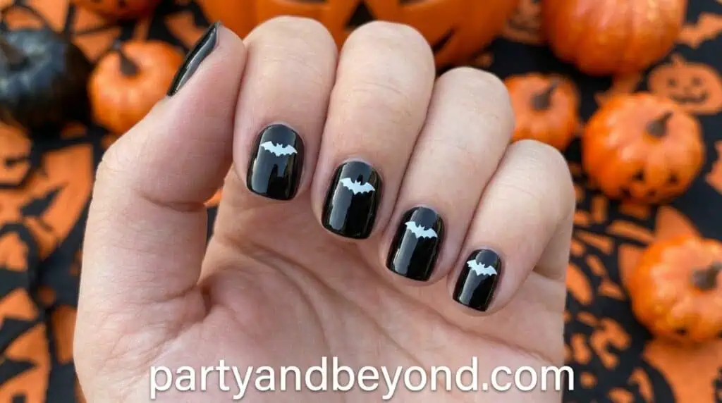 Small bat shapes created using a dotting tool and thin brush strokes. Minimal imperfections make the design look more natural and artistic.