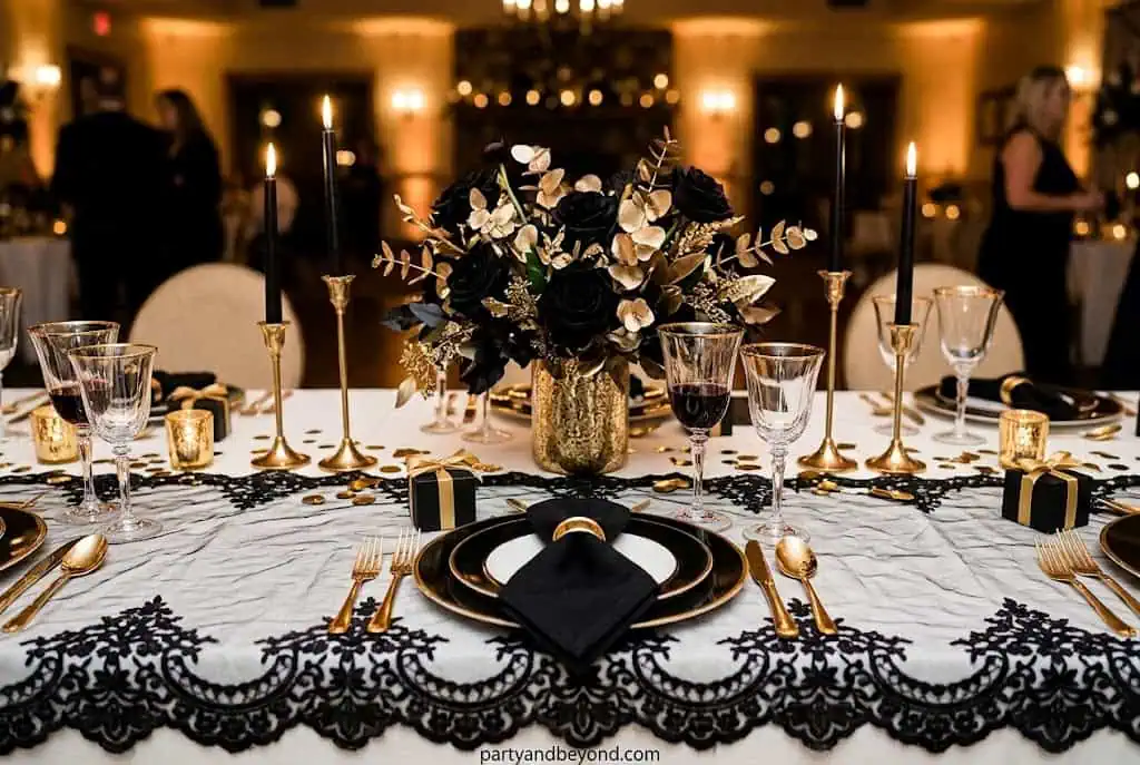 Spooky Halloween graveyard themed dessert table with tombstones and pumpkins.
