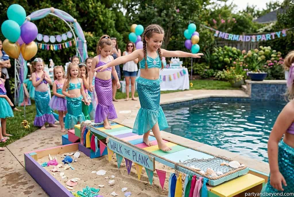 Kids balancing along a taped pirate plank during an under-the-sea birthday party game.