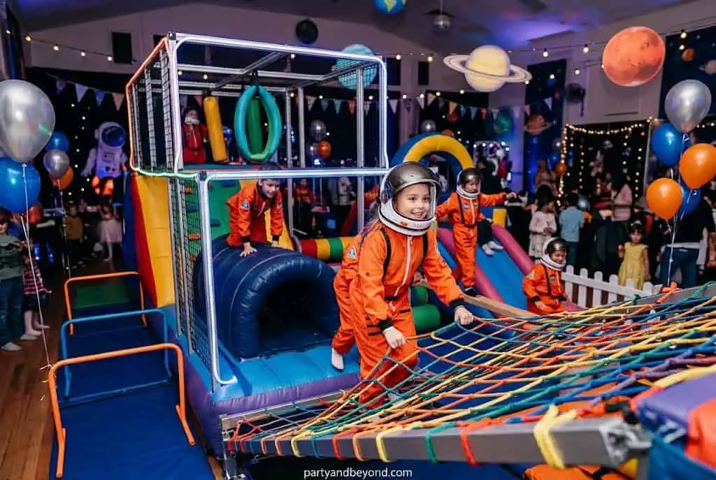 DIY astronaut obstacle course with pool noodles, cones, and moon-themed challenges.